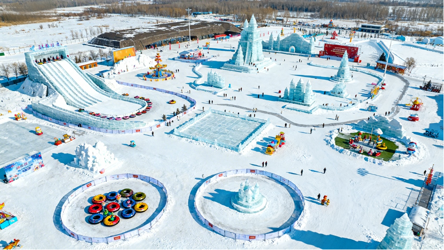 Outdoor snow world featuring snow slides, tubing, and winter activities