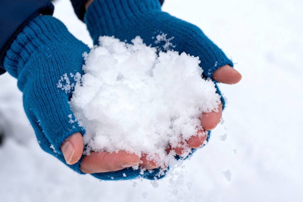Close-up view of artificial snow texture produced by a professional snow making machine