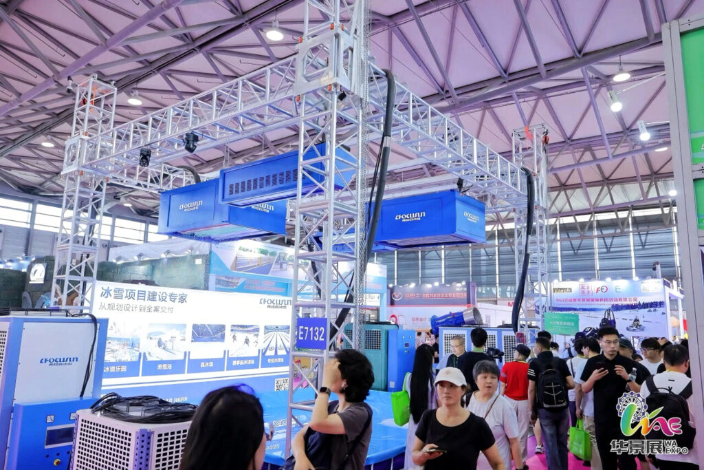 B2B commercial investors and theme park operators exploring advanced all-weather snowmaker systems at the Focusun exhibition site during Shanghai Amusement Expo 2026.